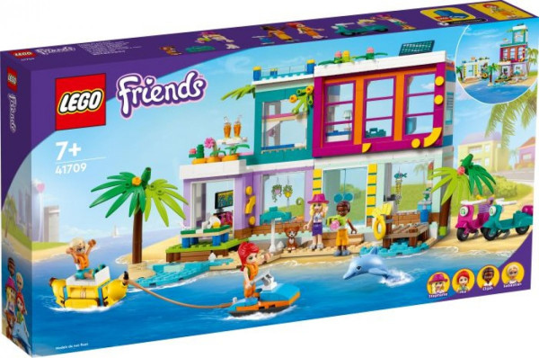 Buntes Haus am Stand Delphin im Wasser